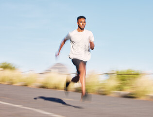 Man, training and running on road in mountain, nature or outdoor exercise and athlete moving with speed, motion or workout. Male, fitness and runner in morning cardio, sports or goals for wellness