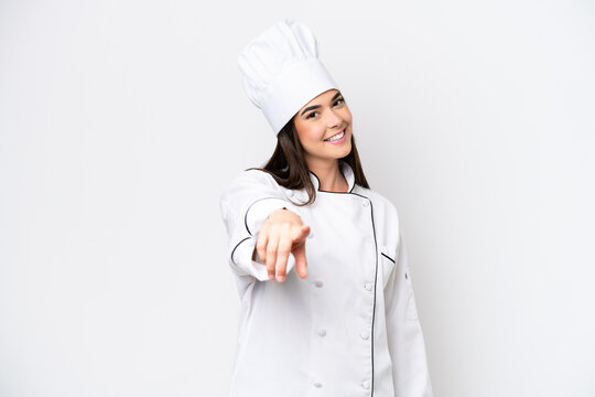 Young Brazilian chef woman isolated on white background points finger at you with a confident expression