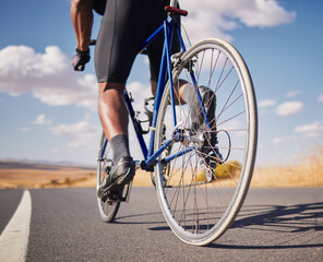 Road, closeup and man on a bike for cycling, race training or travel in the countryside. Health,...