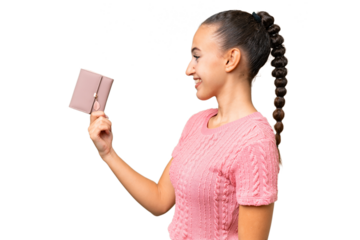 Young Arab woman holding a wallet over isolated background with happy expression