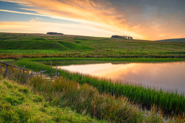 Sunset at Westgate Tarn, also called West Slitt Dam and used in the nearby old Lead Mine at Weardale, County Durham in the North Pennines AONB