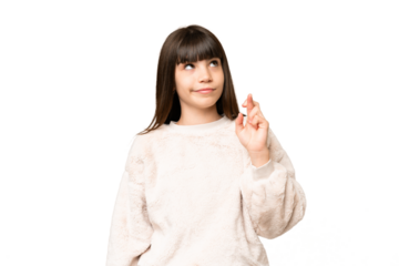 Little girl over isolated green chroma key background with fingers crossing and wishing the best