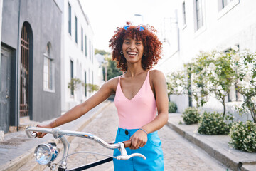 Bicycle, gen z or portrait of happy woman cycling with street fashion in urban outdoor activity on...