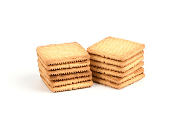 Square shortbread cookies isolated on white background. Stacked butter biscuits for coffee or tee.