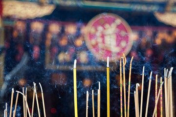 Incense left burning  by worshipers at Wong Tai Sin Temple