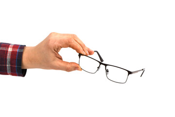 Hand holding plastic black glasses, isolated on white background.