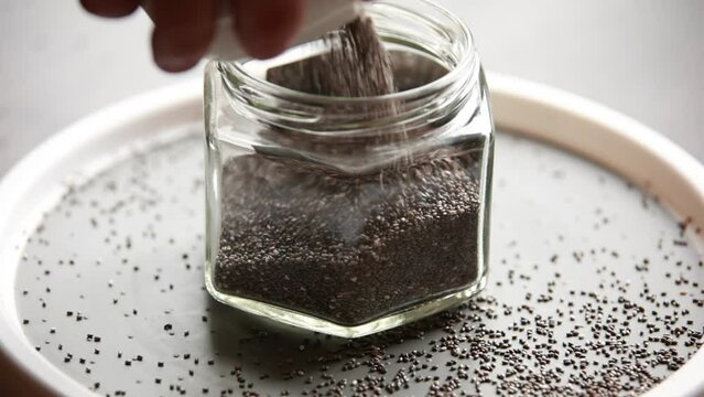 close up raw chia seed in a white bowl on the table