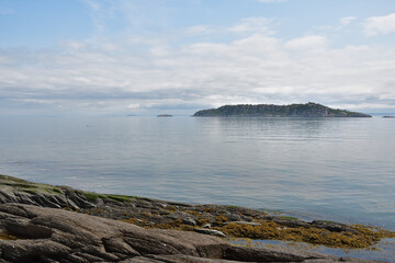 Small islands on St-Lawrence river. Ile aux Lièvres beach with exposed bedrocks.