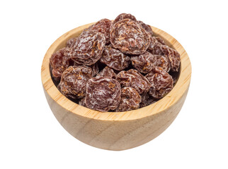 isolate of dried plum in a wooden bowl