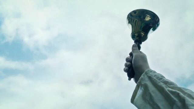 Hand Bell Is Rung Outside