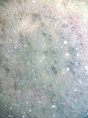 Foam bubbles from soap or shampoo washing on top view