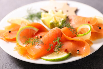 close up on smoked salmon fillet with lemon