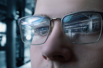 The specialist looks at the production process at the factory.