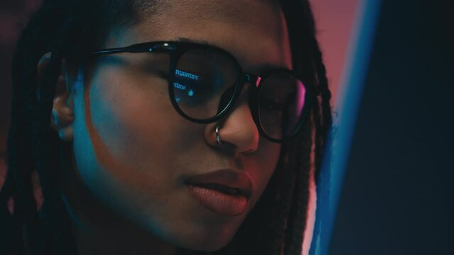 African American woman in glasses opening inbox folder online, checking email