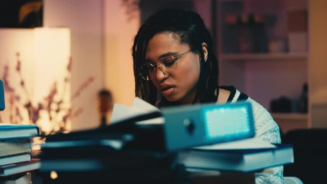 Frustrated African American woman tearing paper at the desk, no inspiration