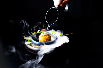 Closeup of some spanish croquettes in a bed of lettuce served as tapas