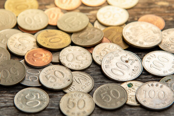 Korean coins placed on a wooden table