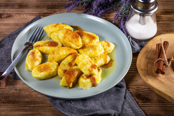 Homemade lazy noodles with cheese, crumbs and melted butter.