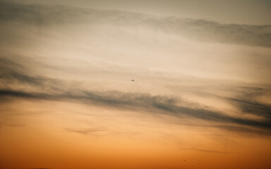 airplane at sunset in the clouds