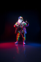 Fototapeta premium Trendy Santa Claus in fluorescent clothes illuminated by neon lights on a dark background. Concept of Christmas and New Year celebration and party, Luminous colors. Generative AI.