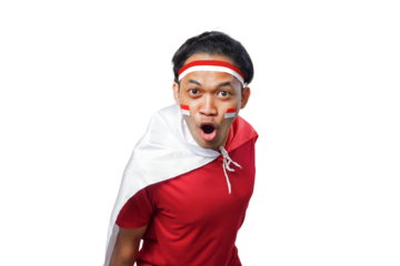 Excited young Asian man holding Indonesian flag while celebrating Indonesia Independence day