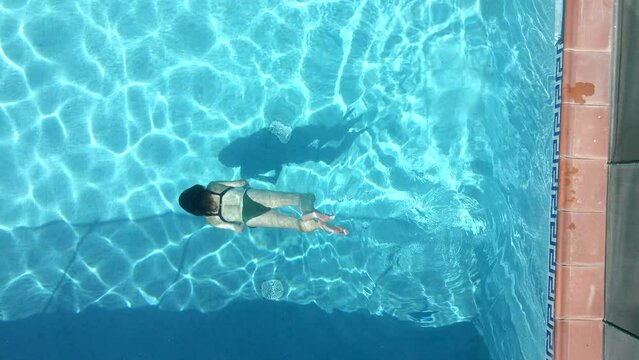 Girl swims underwater 4