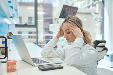 Woman tired from working in the hospital