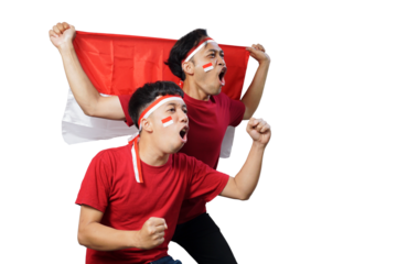 two male friends excited holding attributes of the Indonesian flag together. supporter celebrating victory together over white background