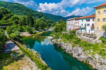 Fototapeta na wymiar A view across the Soca river from the bridge at Kanal in Slovenia in summertime 