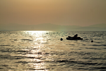 dark sunset silhouette at sea 