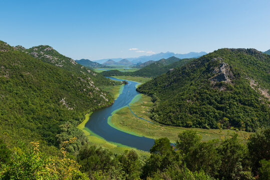 Panoramic view at Pavlova Strana on the river of Crnojevića flowing through green lands to Lake Skadar, Montenegro.