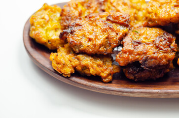 Delicious onion bhaji fritters served on wooden plate as a starter