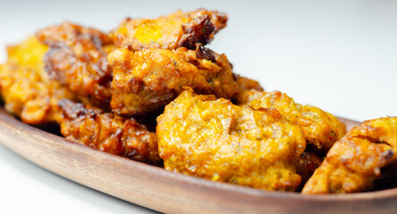 Delicious onion bhaji fritters served on wooden plate as a starter