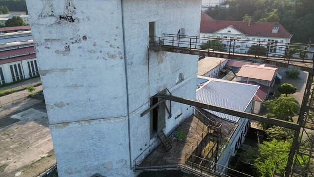 ld industrial tower building Silo, view from near to distant, aerial shot in 4K