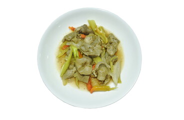 spicy stir-fried chicken gizzard couple liver with slice onion and long green chili on plate 
