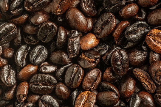 Background of coffee beans and ground coffee in closeup