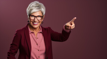 Senior woman wearing casual clothes pointing with hand and finger to the side looking at the camera.