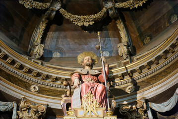 polychrome sculpture of the baroque altar with the image of Saint James the Greater on his throne...