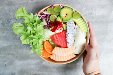 fruit and vegetable salad or cantaloupe, dragon fruit and lettuce salad