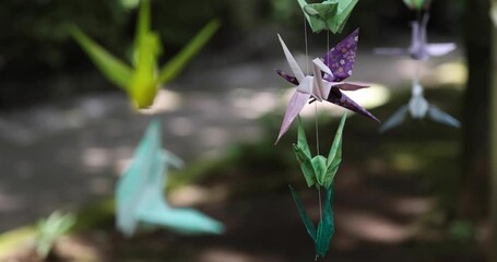 A paper crane swaying in the wind at the traditional street focusing