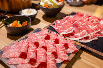 Slice of fresh raw beef in Hot pot restaurant