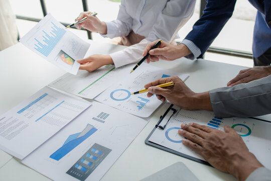 Atmosphere of a startup company meeting, business people are meeting together to summarize and plan investment finances, they are the founders of the company. Business administration concept.