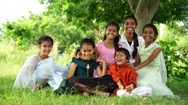 Indian cute little girls and boy enjoying life, smiling and celebrating indian festival rakhi or bhai duj