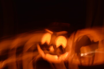 Abstract Halloween carved pumpkin in motion steam black cat and Jack-o-Lantern 
