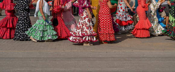 The essence of Andalusian culture captured in a vibrant flamenco dress adorned with polka dots. An emblem of Spanish dance and festive celebrations, oozing traditional flair. - obrazy, fototapety, plakaty