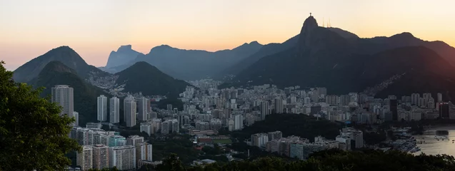 Poster Rio de Janeiro, Brazil: panoramic view at sunset from Sugarloaf Mountain with view of Humaitá district, the Christ the Redeemer on top of Mount Corcovado, Botafogo district and beach © Naeblys