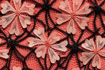 Seamless pattern - repeatable texture of floral crochet red and black lace