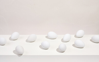 White chicken eggs lay on the table. Unique product contains large number of useful substances.