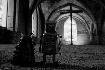 Fototapeta na wymiar an old style metal robot and small robot are in front of an arched doorway