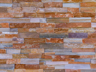 Background pattern of differently colored natural stones